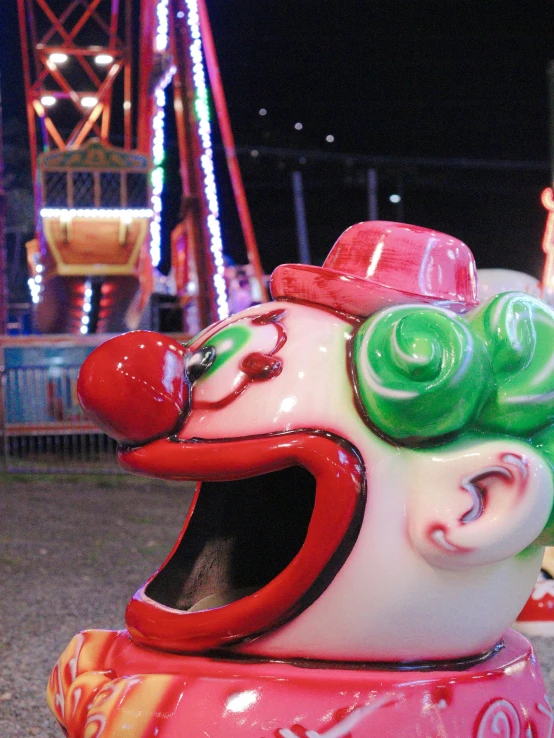 an amut park has many carnival rides at night