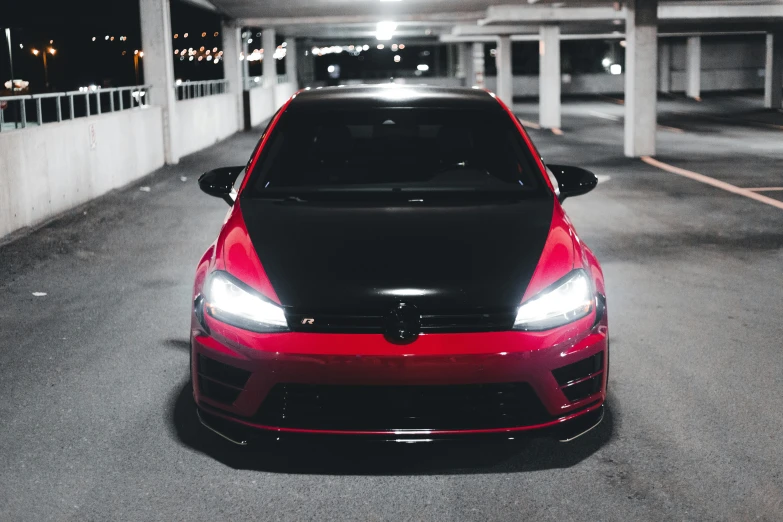 a sleek car that has black, red and white stripes