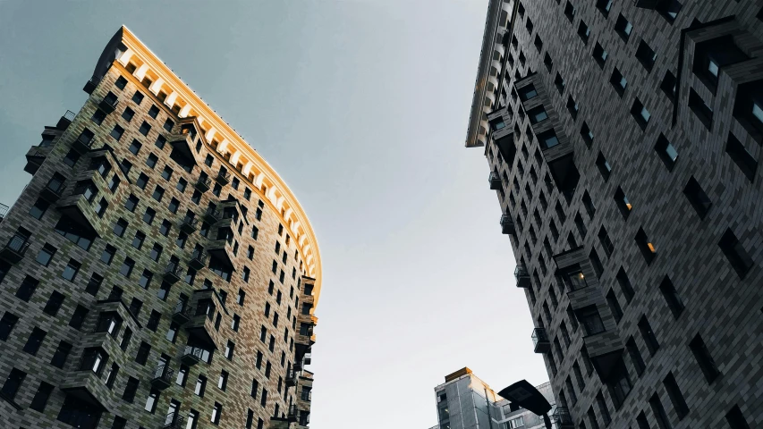 two very tall buildings with lots of windows