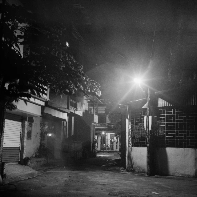 a night time street scene of an alley way
