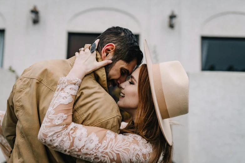 a man with a beard and glasses on emcing a woman