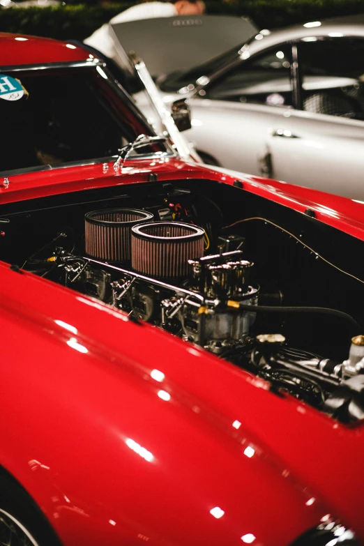 a close up of a red sports car engine