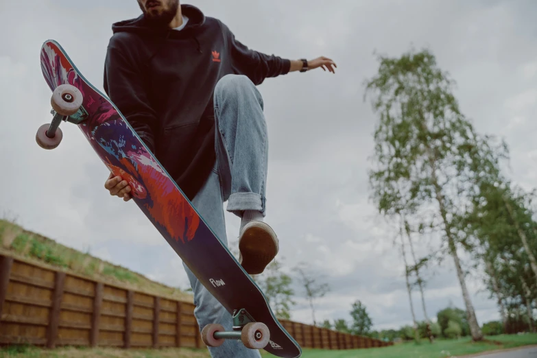 a man flying through the air while holding onto a skateboard