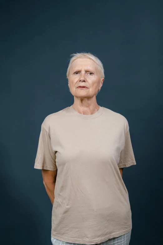 a white woman with short grey hair posing for a picture