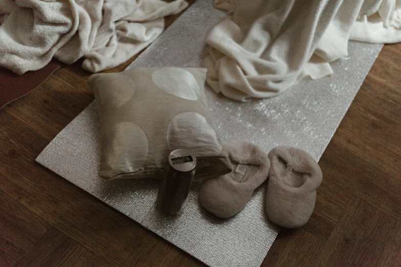 several pairs of shoes are laid out on the carpet