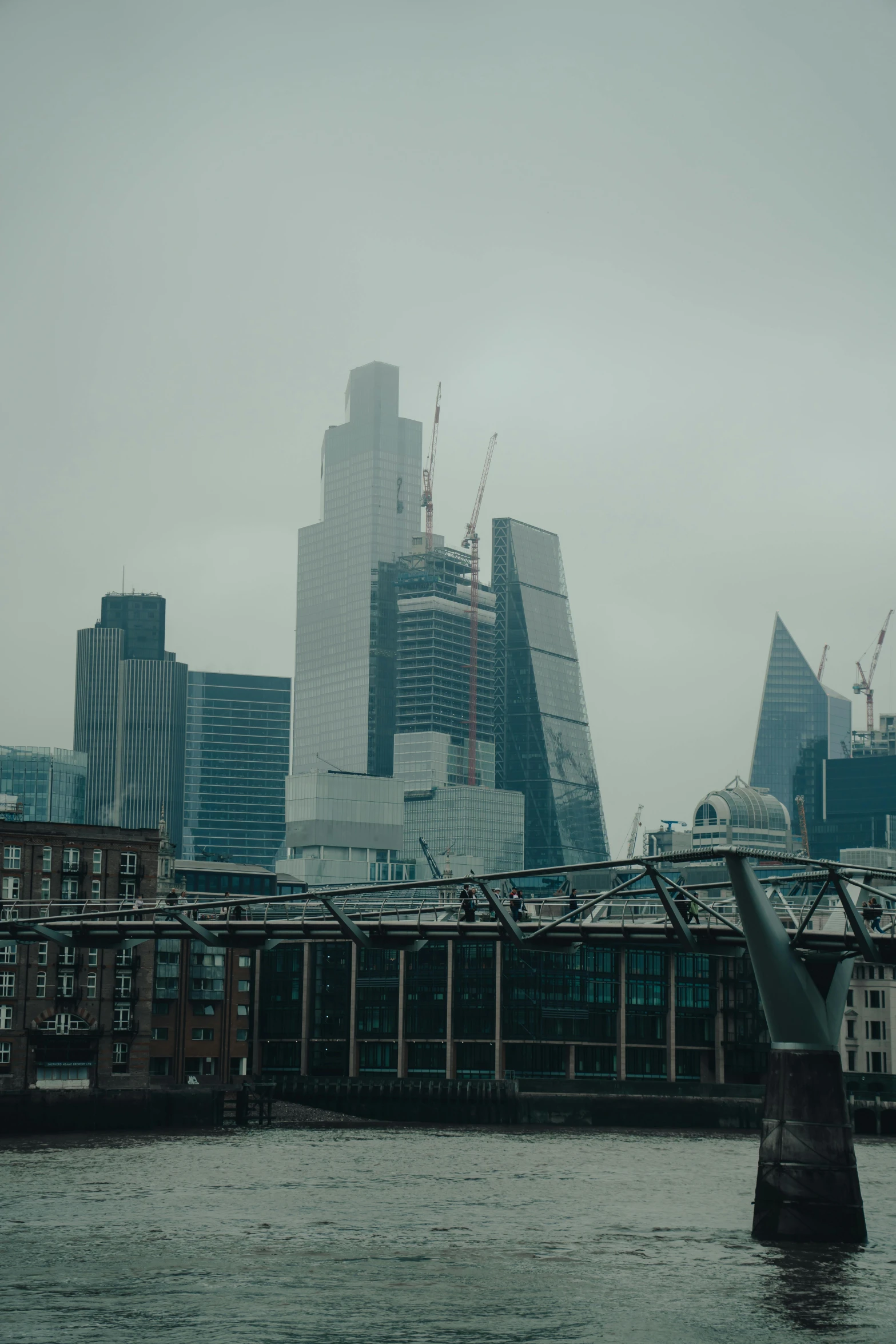 the city skyline is next to a body of water