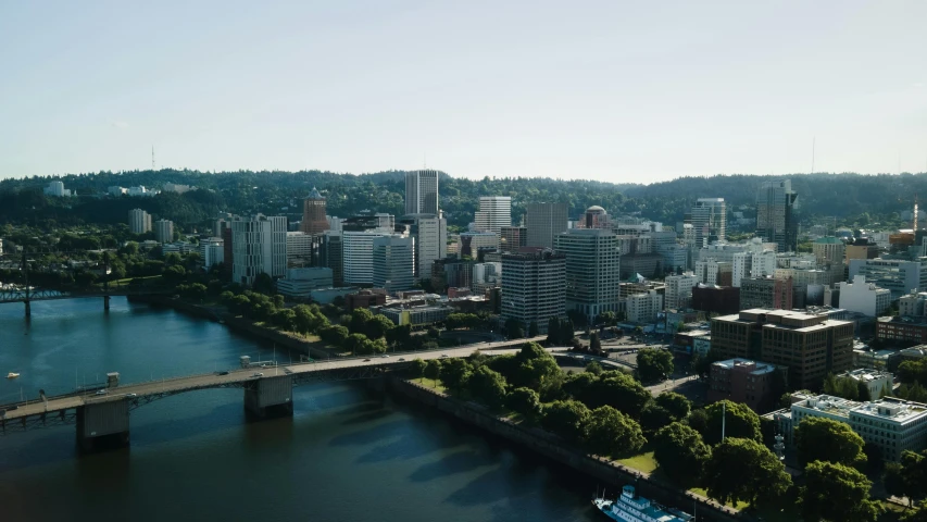 a view of a bridge over a river and city