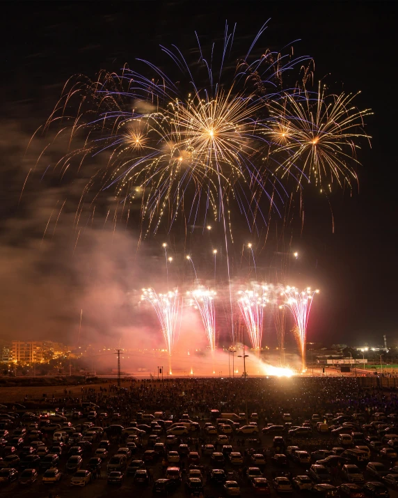 fireworks in the night sky with large and small lights above