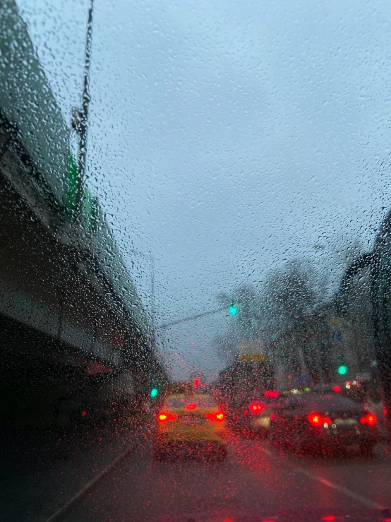 car dashboard as seen through a window in rain