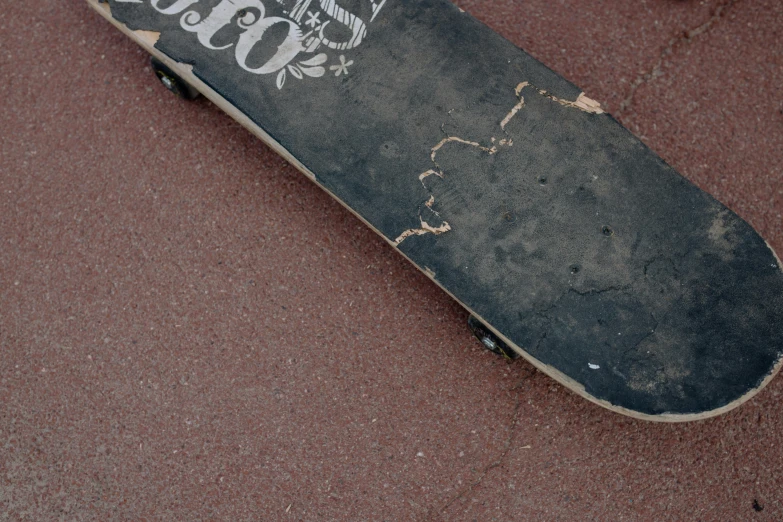 a skate board with coca cola painted on the bottom