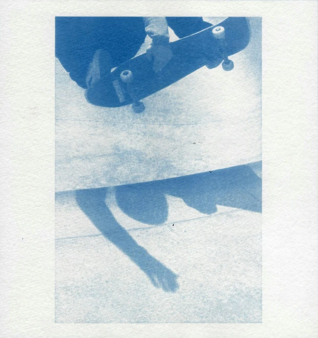 an image of the skate boarder going down the ramp