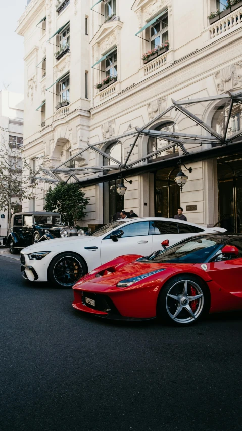 the cars are parked in front of this apartment building