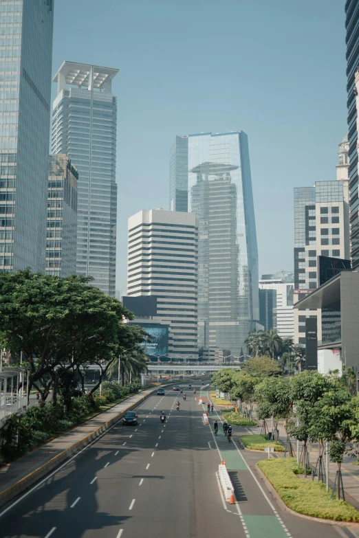 a city road in a large metropolitan area with tall buildings