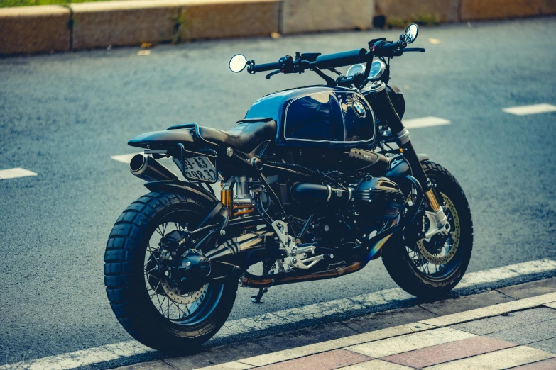 the motorcycle is parked by the curb in the city