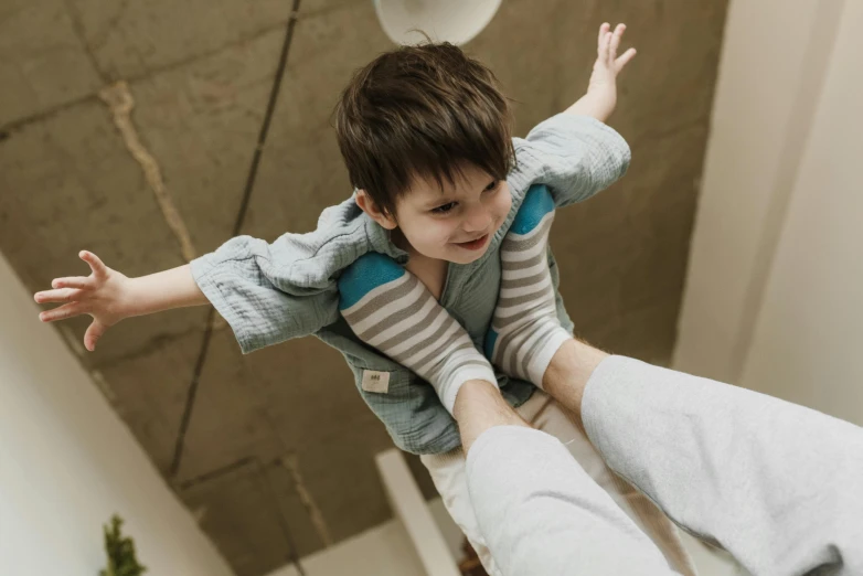 a child is being held back by another child