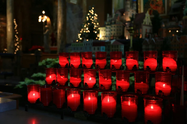 there are several red paper lanterns sitting in a row