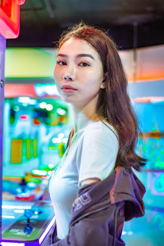 a woman standing next to a traffic signal light