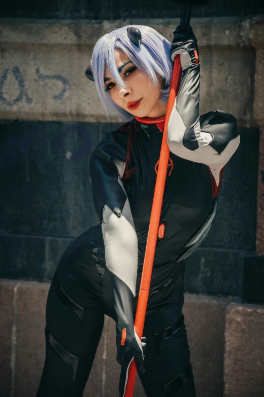 a woman with white hair holding an orange bat