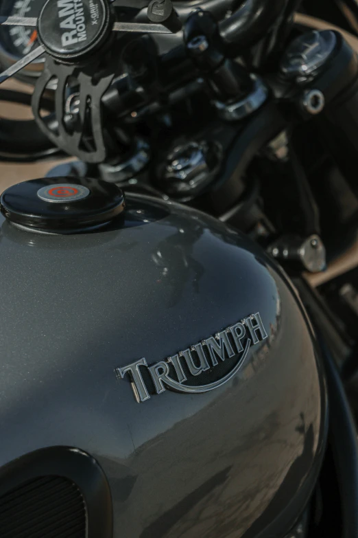 a black triumph motorcycle with its badge