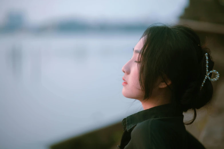 the back view of a woman with her hair in a bun