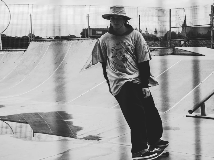 a young man skateboarding at a skate park