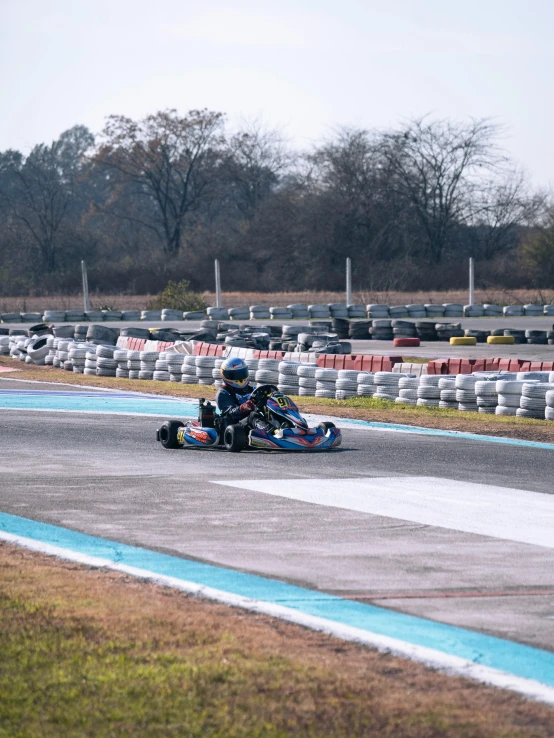 a person on a motorcycle driving around a track