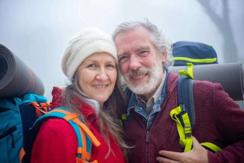 the man and woman are posing for a picture