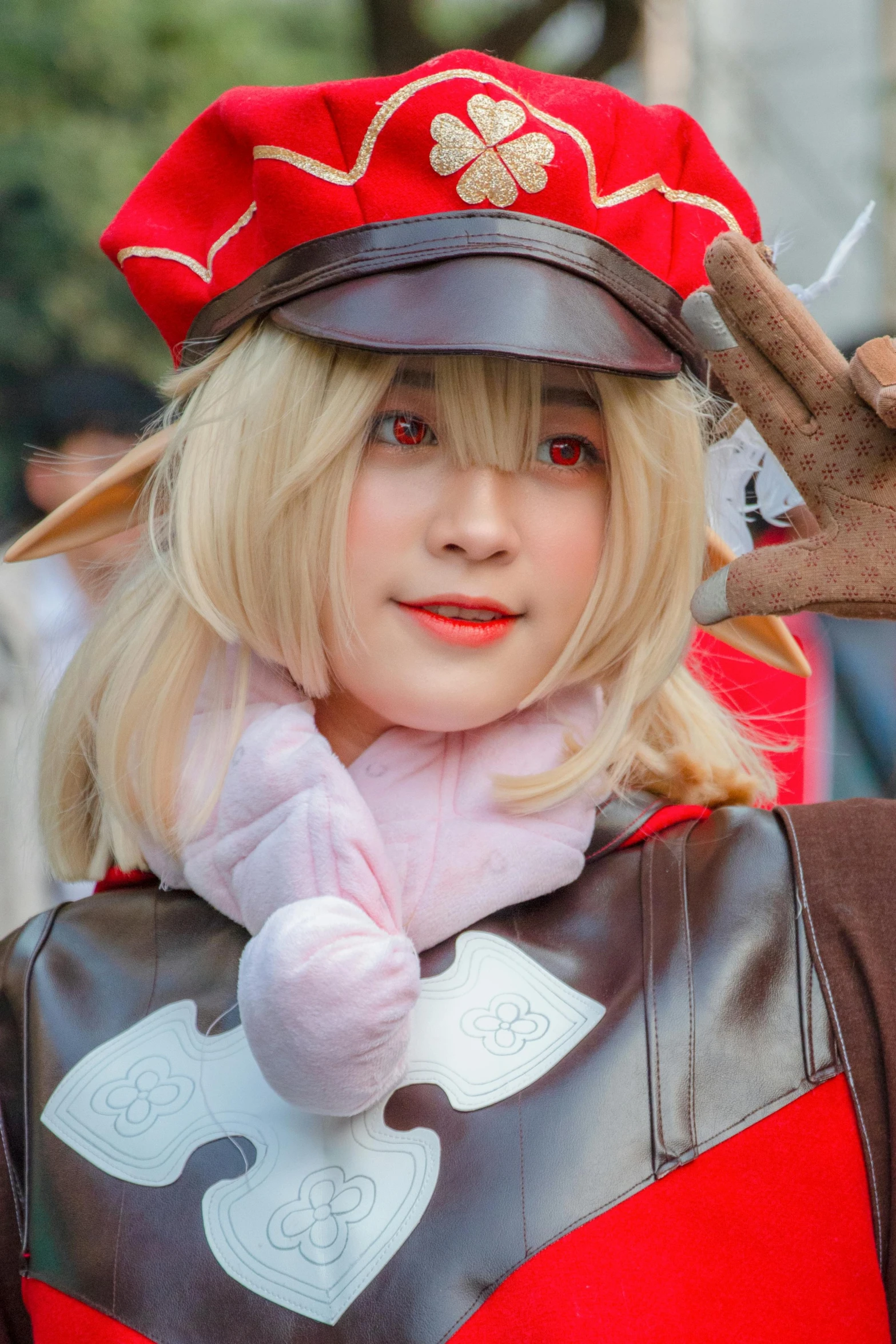 a girl dressed as a costume and a hat holding up a cigar