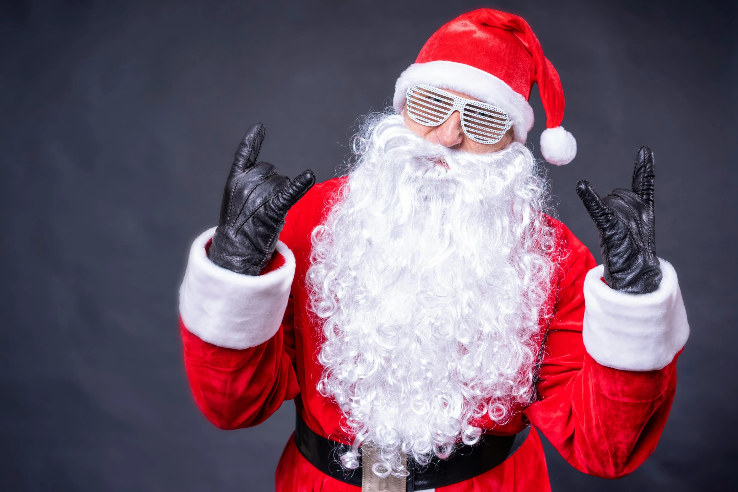 a santa claus is holding up two fingers