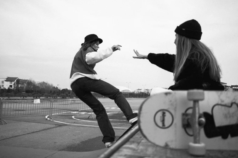 a young man riding on top of a skateboard