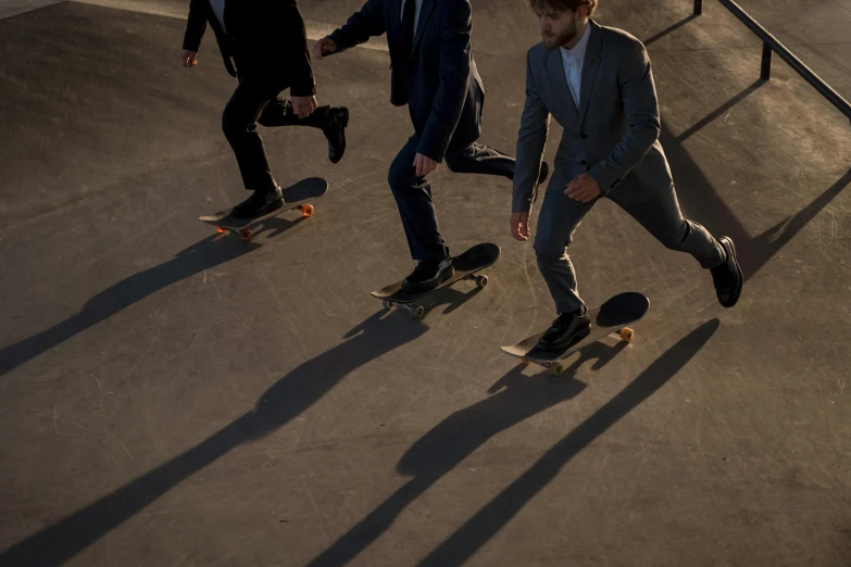 two guys are skating together on their skate boards