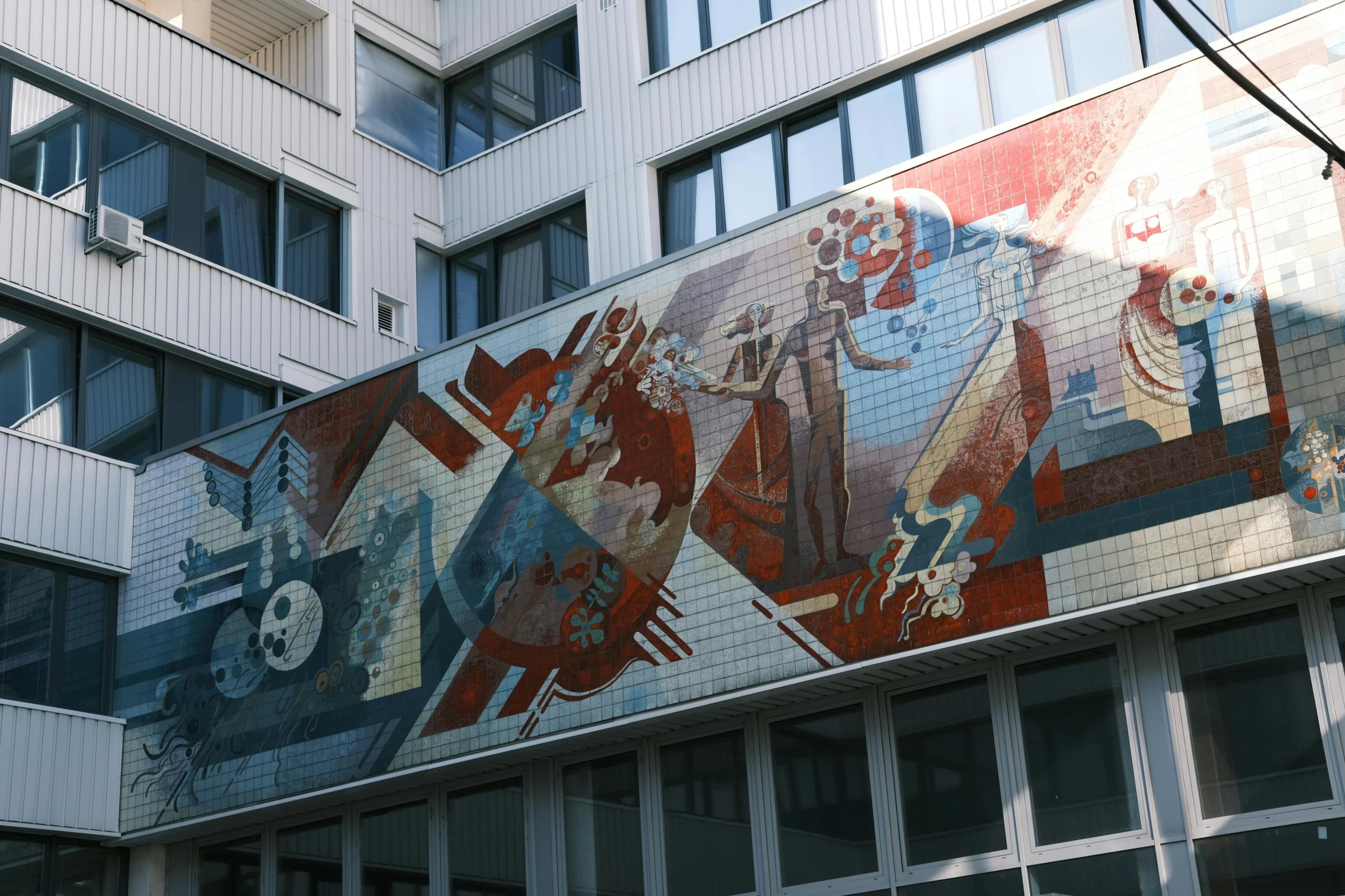 a large building with an artistic mural on it