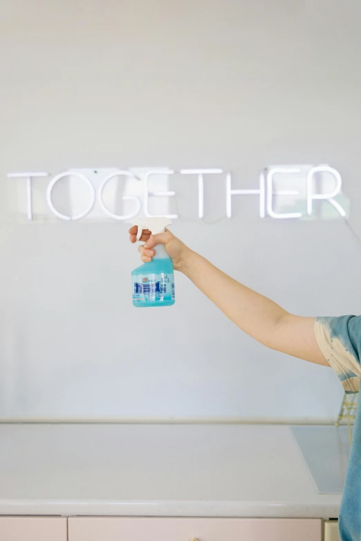 a woman putting soing in her hand that reads together