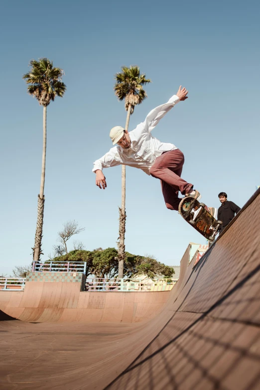 a young person skateboards along the side of a ramp