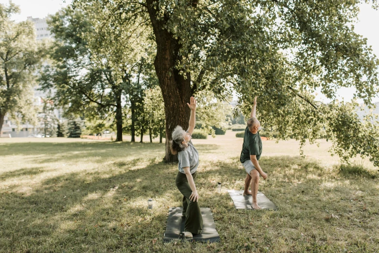 a woman and child standing on a park