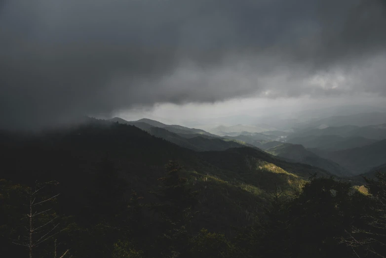 some mountains with a cloudy sky