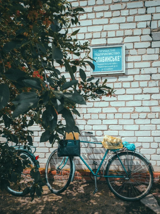 a bicycle leaned against a wall on the side of a building