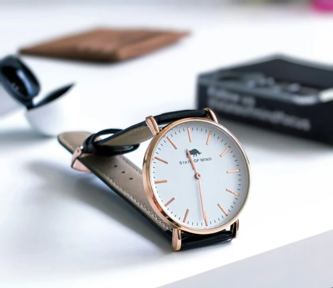 a close up of a watch sitting on a table