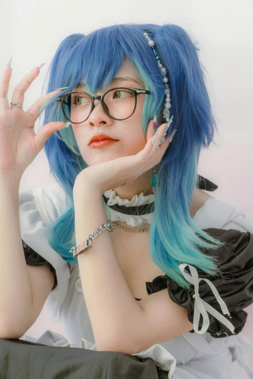 the girl is posing in a costume that has blue and green hair