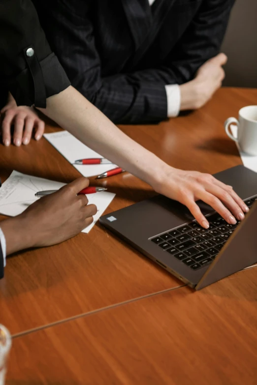 a person with a laptop on their desk