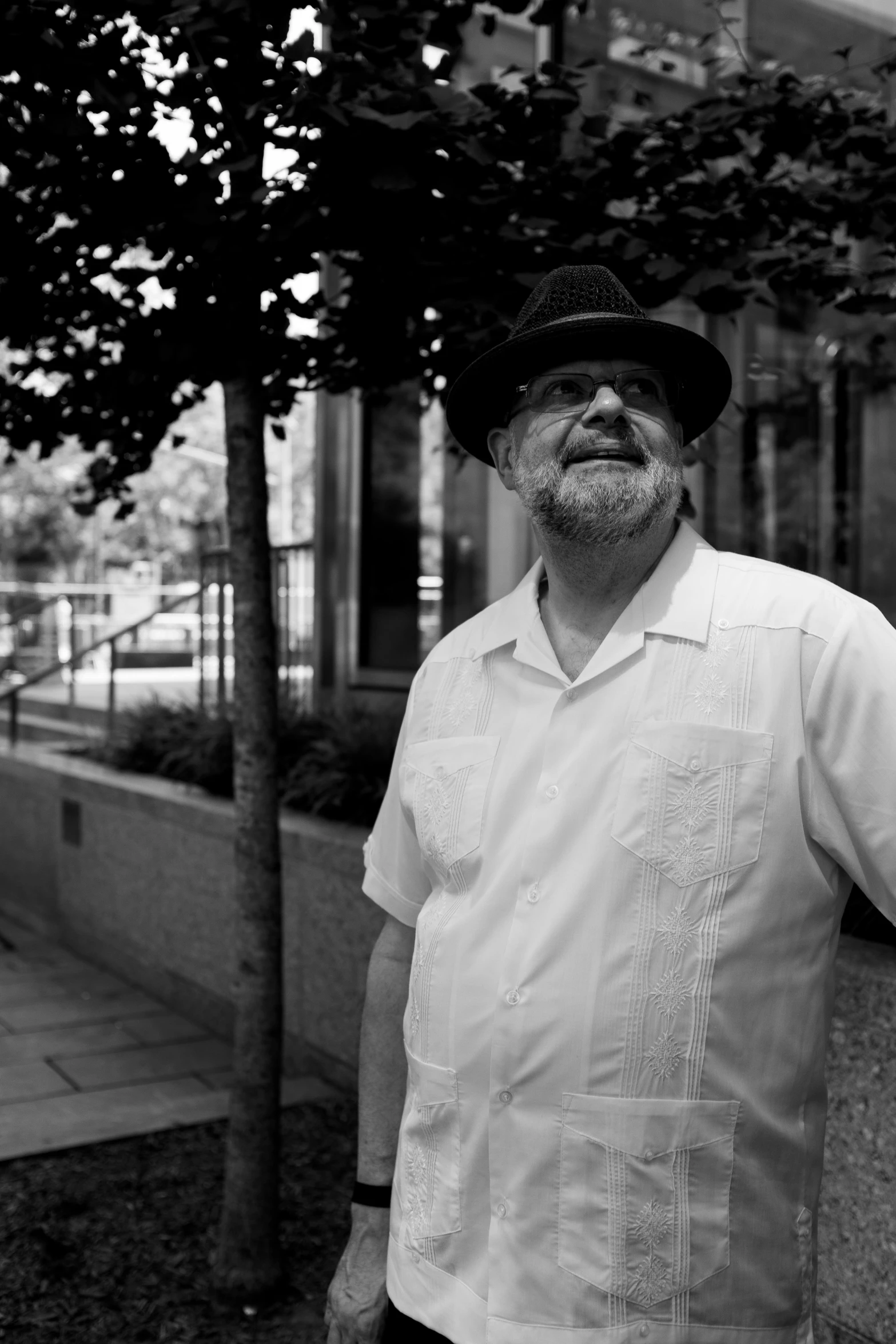 a man wearing a fedora and a hat