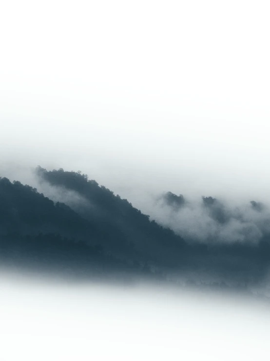 a lone boat on a body of water with a very big mountain in the background