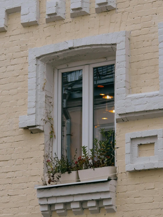 the balcony is attached to the wall with a window