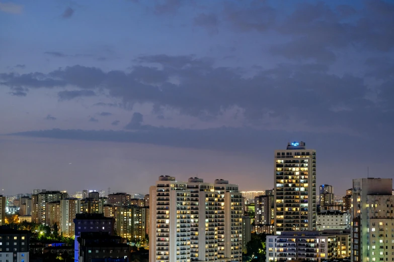 a beautiful city skyline with a clock tower lit up