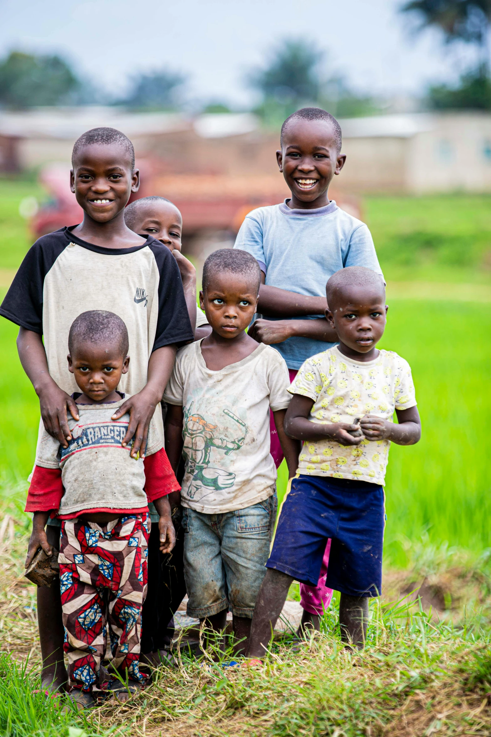 six children of different races stand in front of the camera