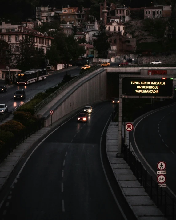 a dark view of traffic going down a freeway