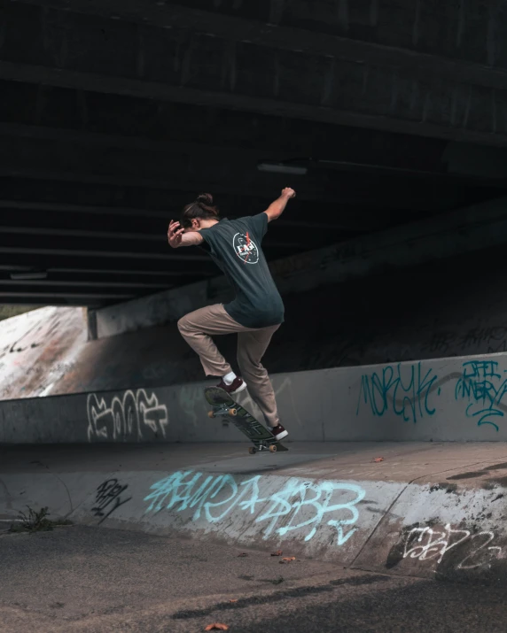 a boy riding a skateboard up the side of a ramp