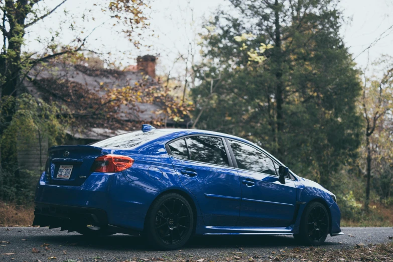 a blue police car parked on the side of the road