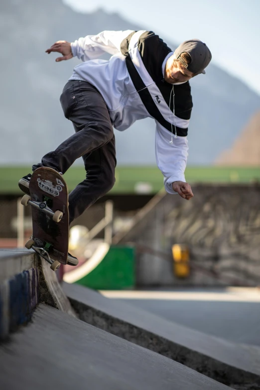 a man riding a skateboard up the side of a ramp