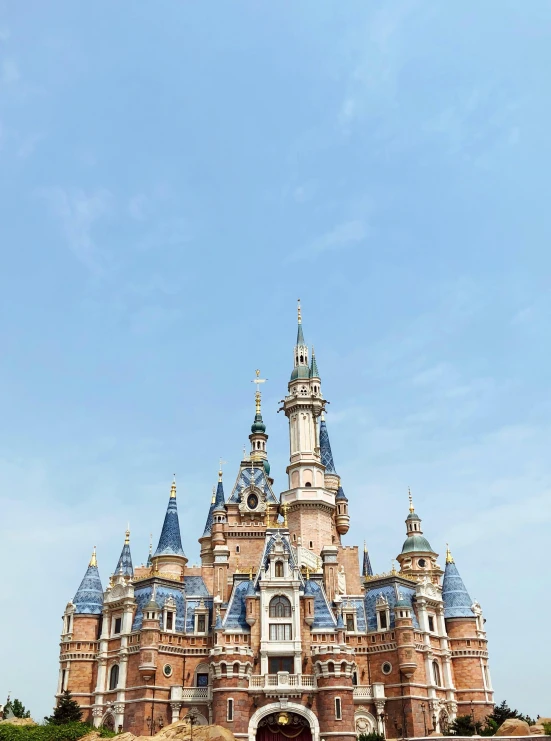 a castle in a park with a clock tower